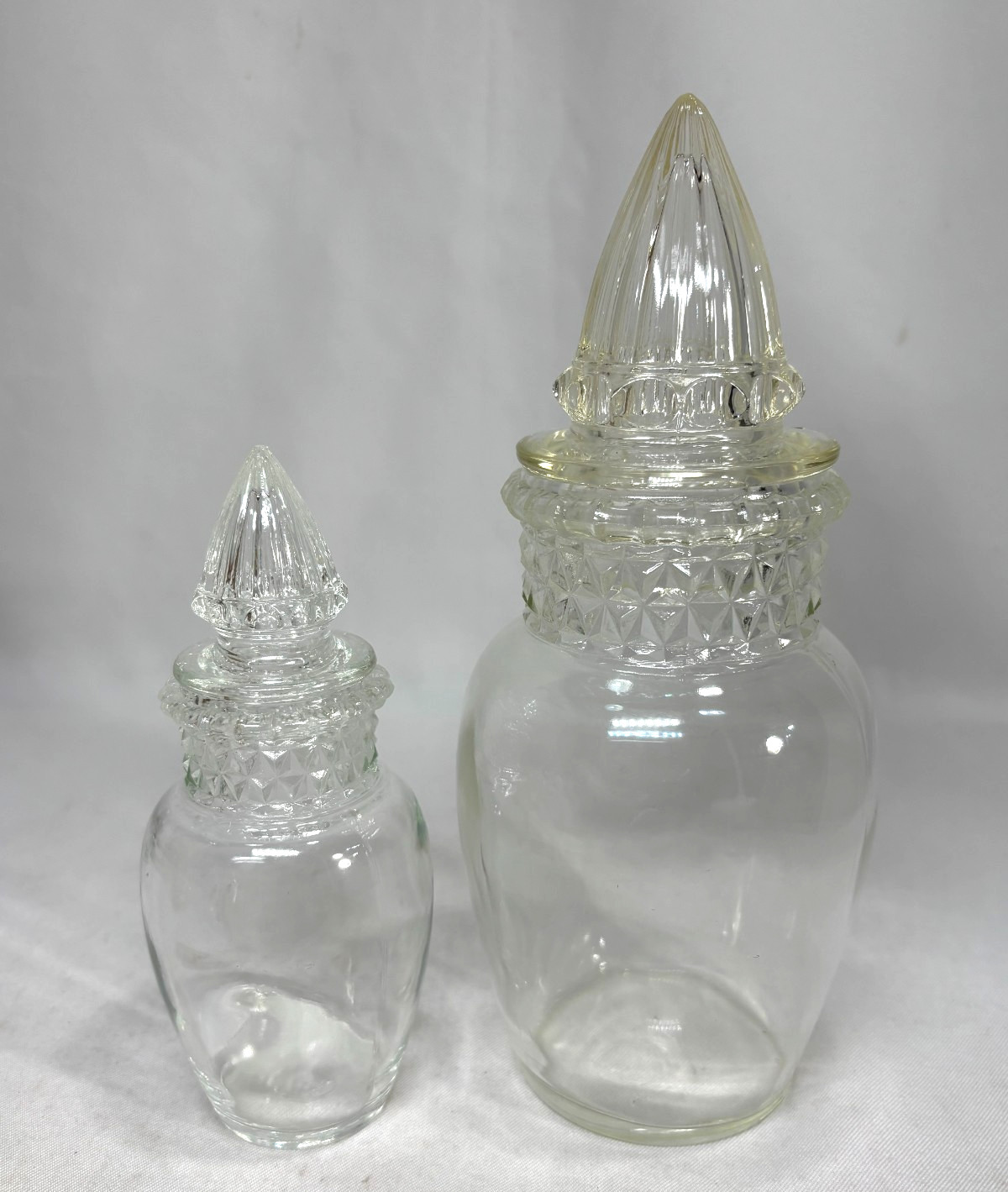 2 Antique High Dakota Clear Glass Pointed Lid Apothecary Jars 9.5″ & 6.75″ tall