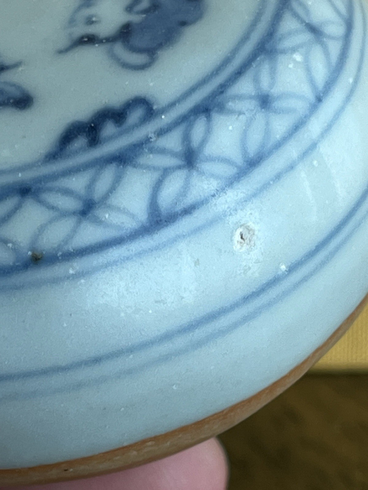 Antique blue and white porcelain paperweight with infant motif