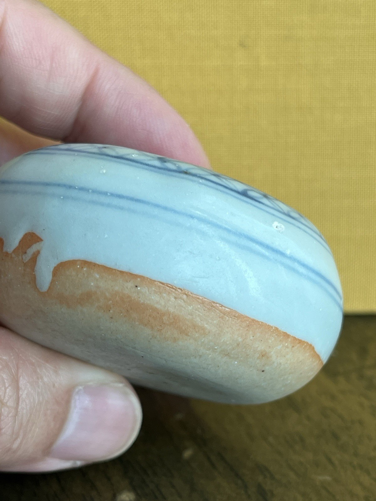 Antique blue and white porcelain paperweight with infant motif