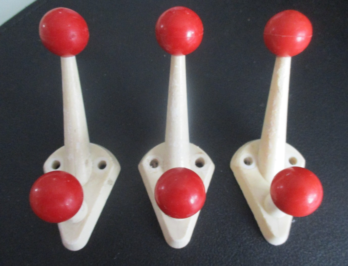 Three 1950s wall hooks