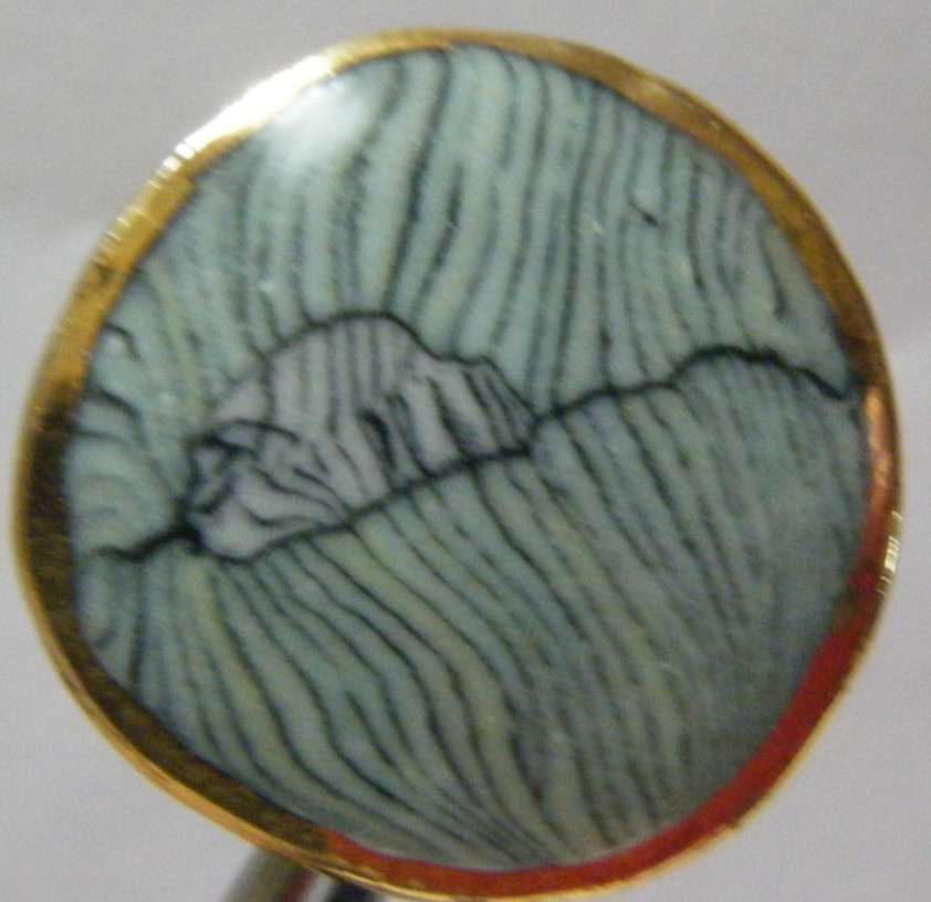 VTG Button ceramic with marbled center and gold tone rim metal shank 1 ” diam.