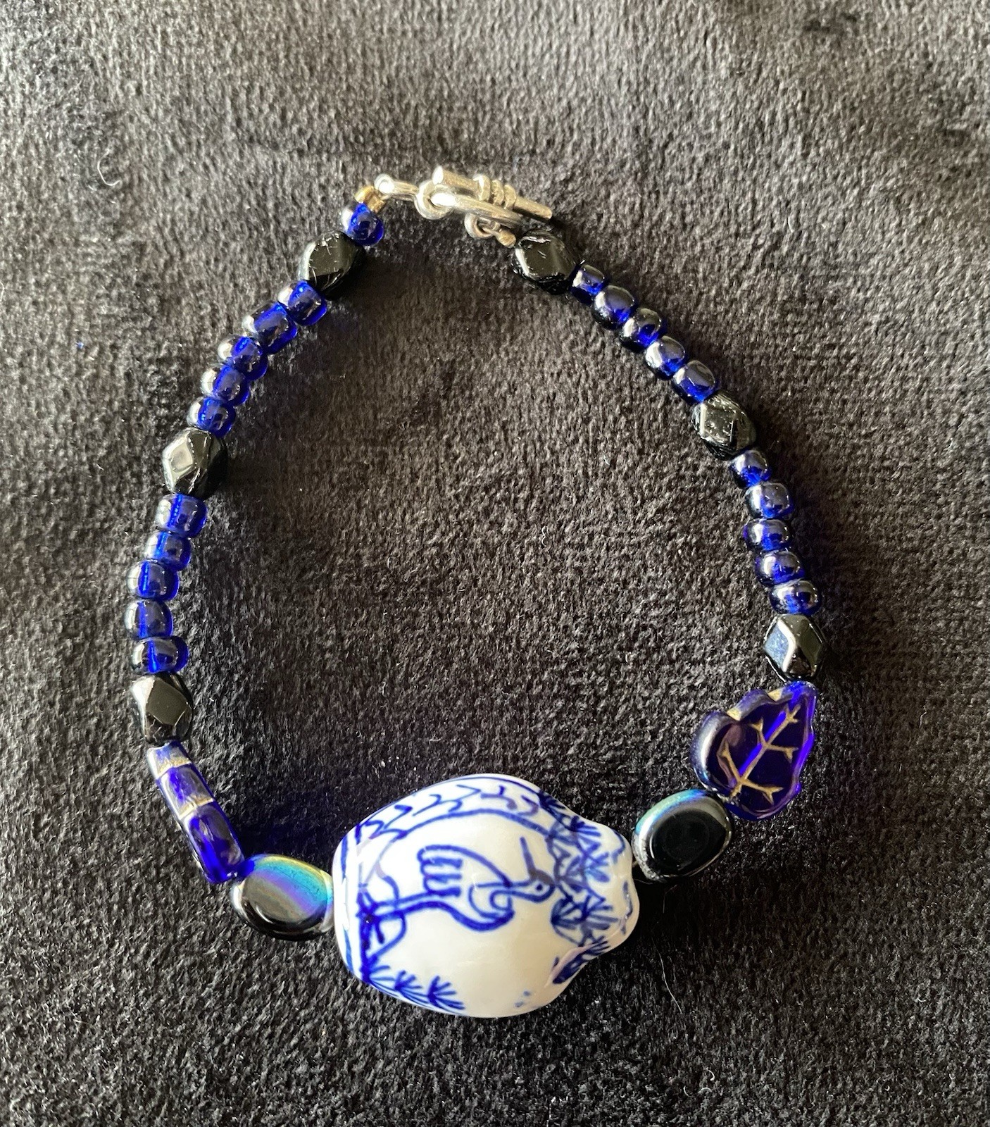 Asian Hand Painted Stork Bead W/ Translucent Dark Blue Accent Beads Toggle Close