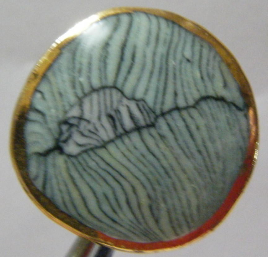 VTG Button ceramic with marbled center and gold tone rim metal shank 1 ” diam.