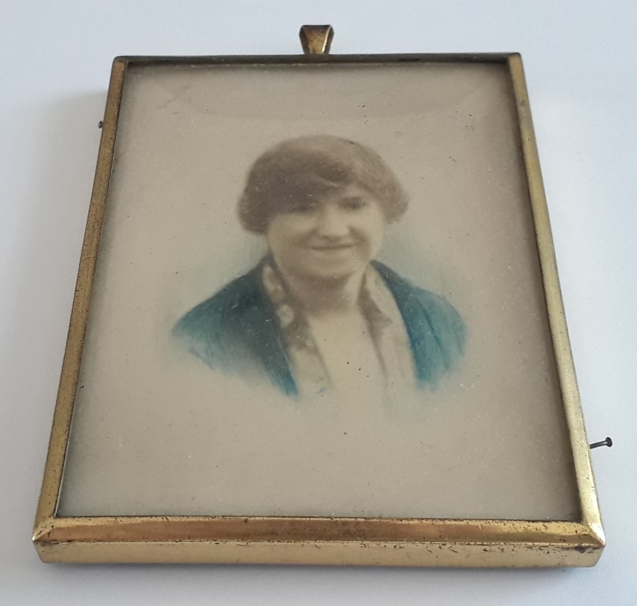 Hand Painted Portrait of a Lady on a Gold-Tone Metal Pendant Frame. c1940.